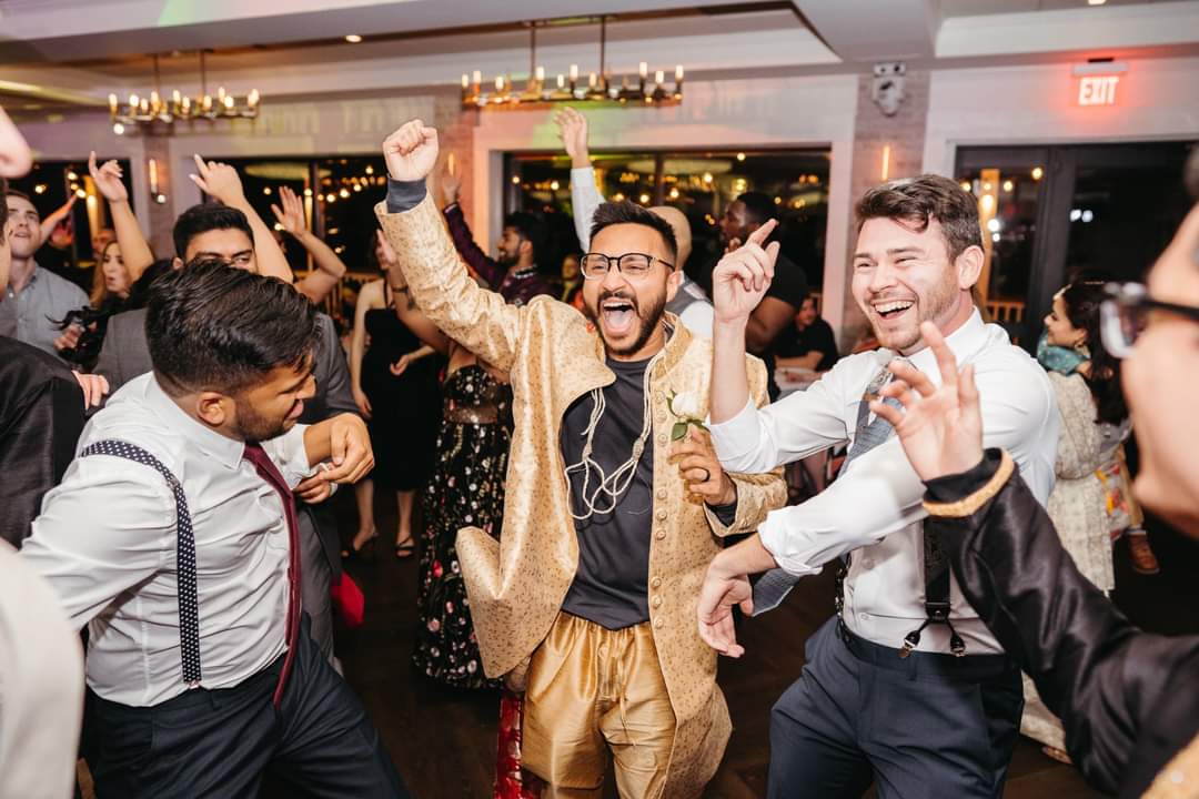 Packed multicultural wedding dance floor celebrating at a New England reception with Angel Alba DJ Entertainment