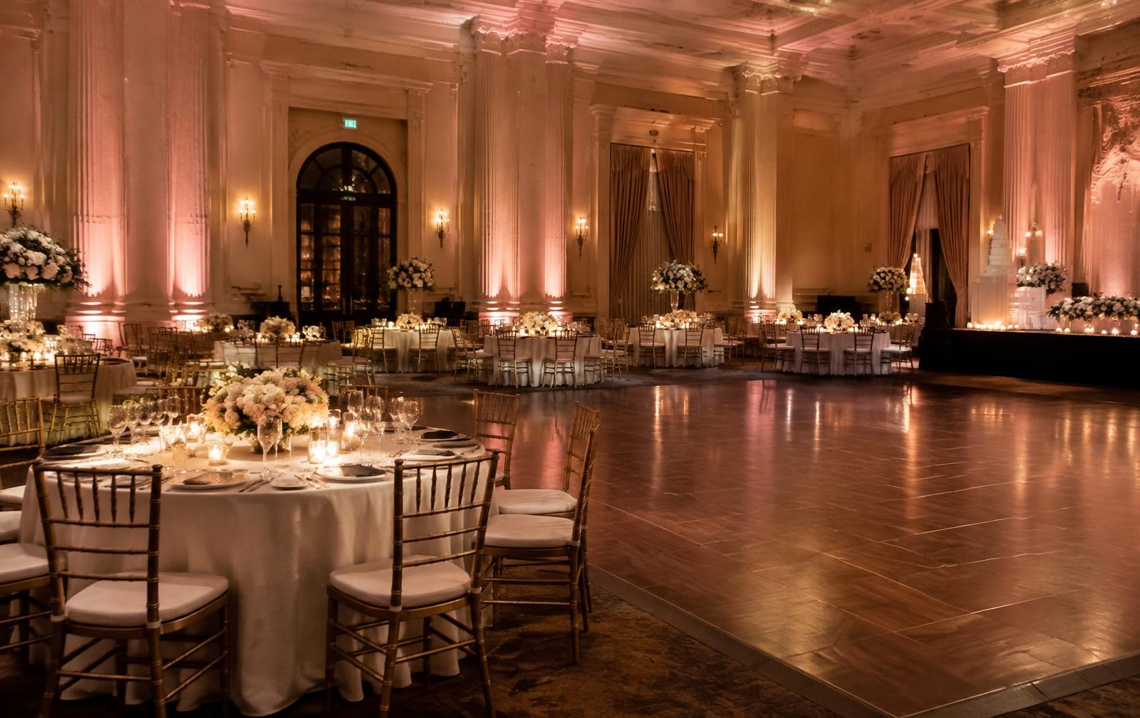 Wedding ballroom shown without uplighting and with warm blush uplighting — with with uplighting